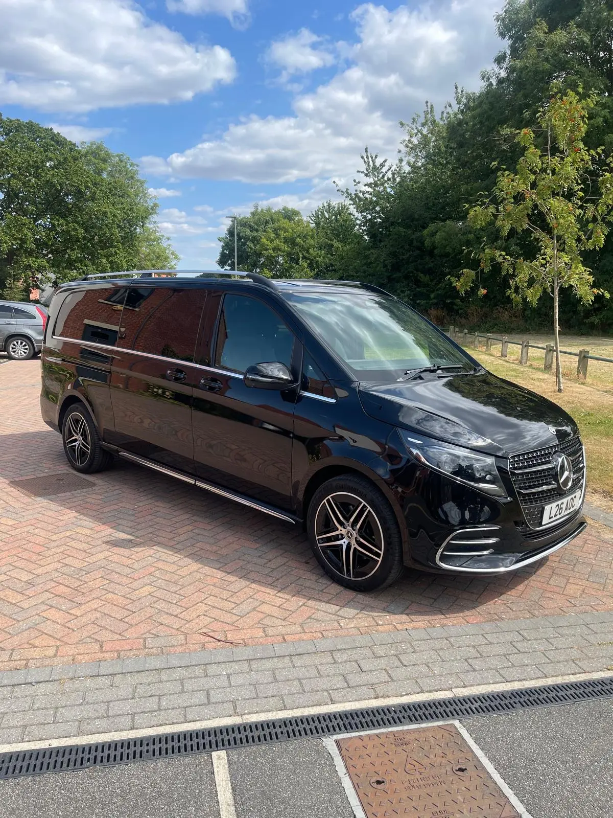 Mercedes-Benz V-Class executive van parked outside a hotel